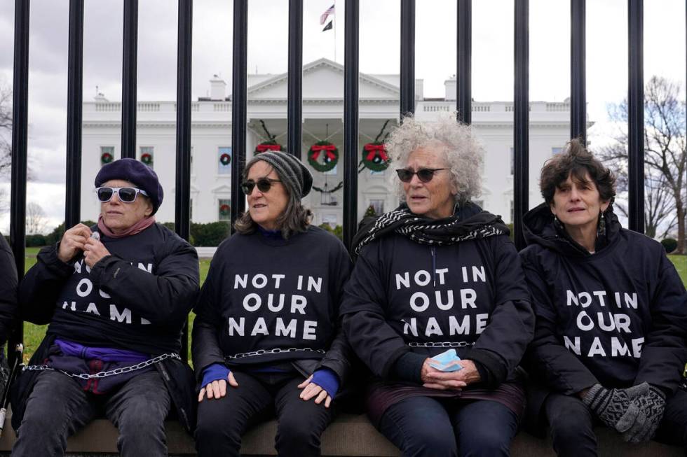 Activists with Jewish Voice for Peace, gather to protest the Israel-Hamas war in Gaza and chain ...