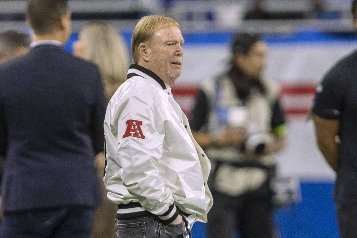 Raiders owner Mark Davis watches team warm ups from the sideline before an NFL game between the ...
