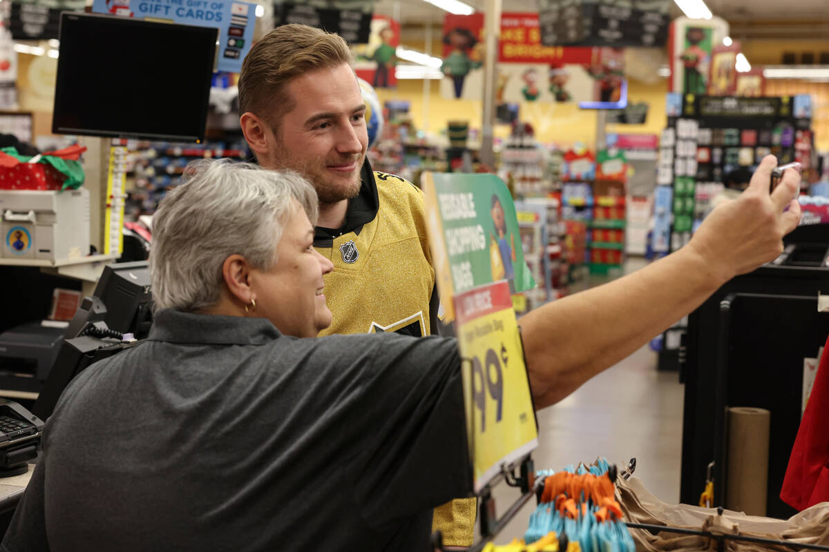 Golden Knights left wing Ivan Barbashev takes a selfie with a fan at a Smith's on Monday during ...