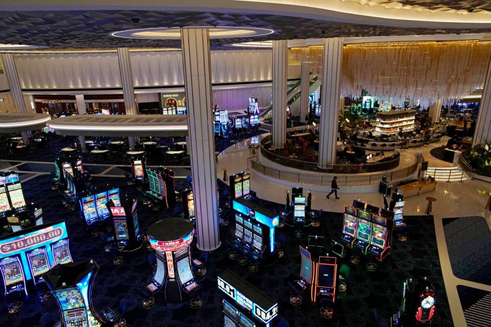 People walk through the casino area at the Fontainebleau Las Vegas hotel-casino Tuesday, Dec. 1 ...
