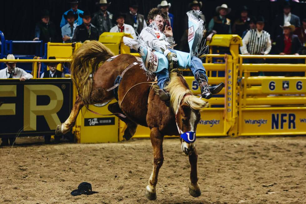 Keenan Hayes rides Lil Red Hawk during round one of bareback riding during NFR in the Thomas &a ...