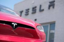 File - An unsold 2023 Model X sports-utility vehicle sits outside a Tesla dealership June 18, 2 ...