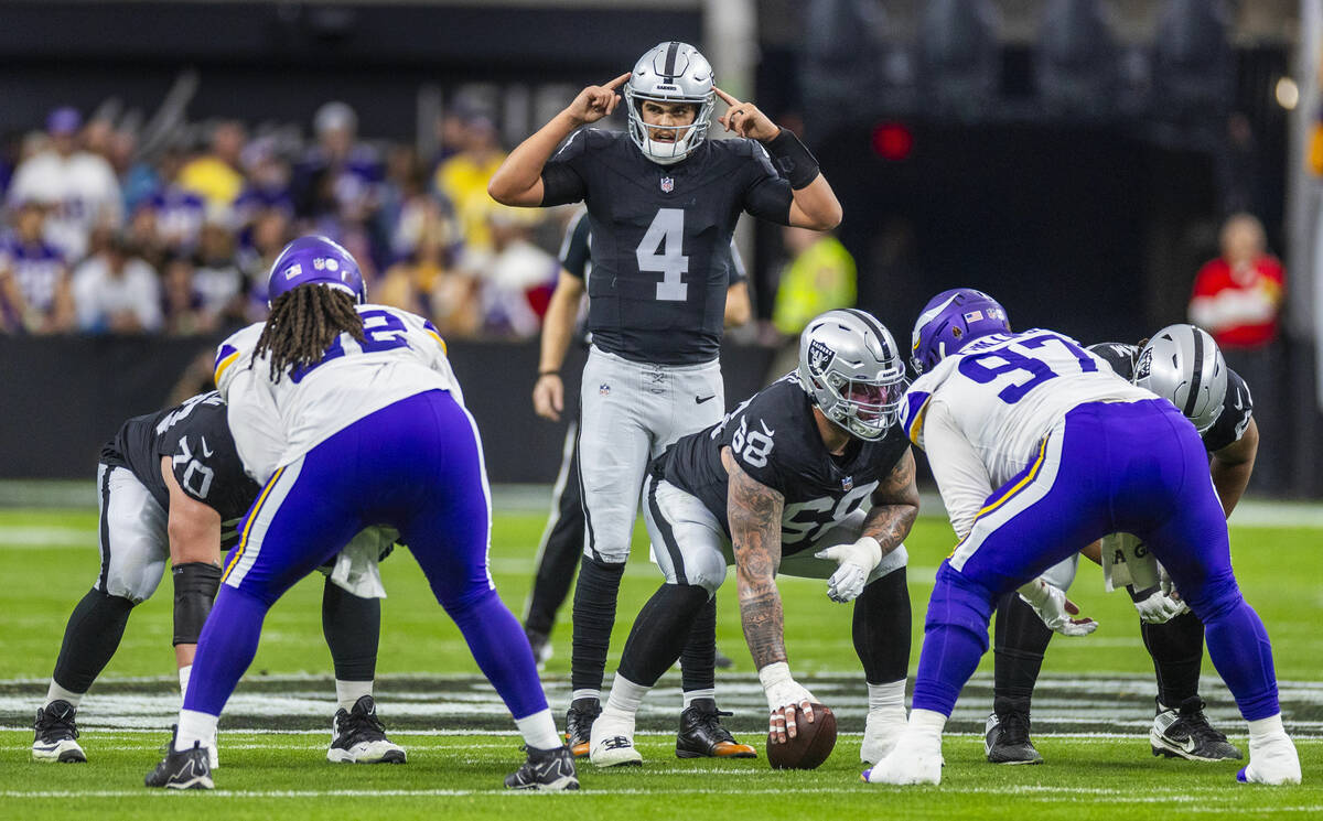 Raiders quarterback Aidan O'Connell (4) signals to teammates against the Minnesota Vikings duri ...