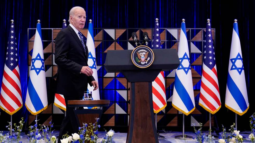 FILE - President Joe Biden walks to the podium to deliver remarks on the war between Israel and ...