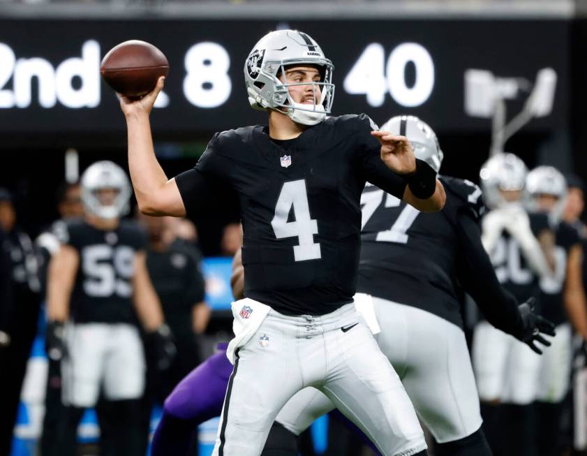 Raiders quarterback Aidan O'Connell (4) throws a pass during the first half of an NFL football ...