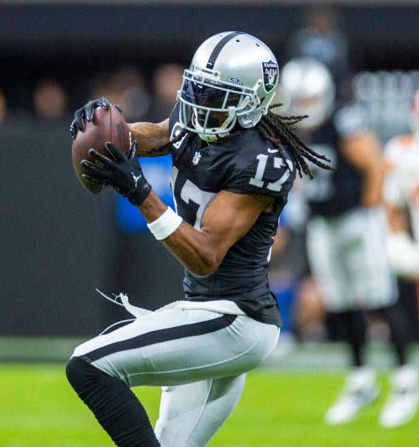 Raiders wide receiver Davante Adams (17) makes a reception during the first half of their NFL g ...