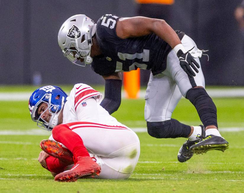 New York Giants quarterback Daniel Jones (8) goes down with a knee injury as Raiders defensive ...