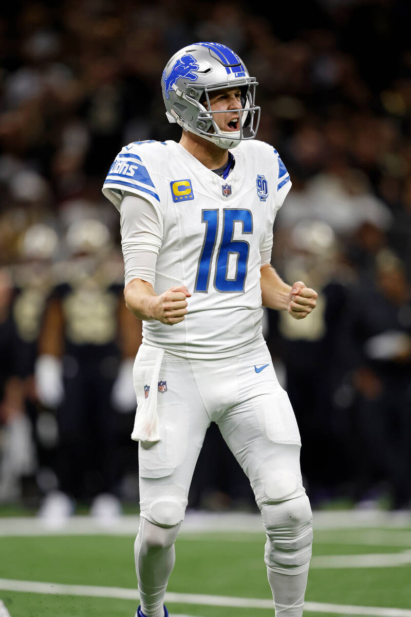 Detroit Lions quarterback Jared Goff (16) celebrates after throwing a touchdown pass during an ...