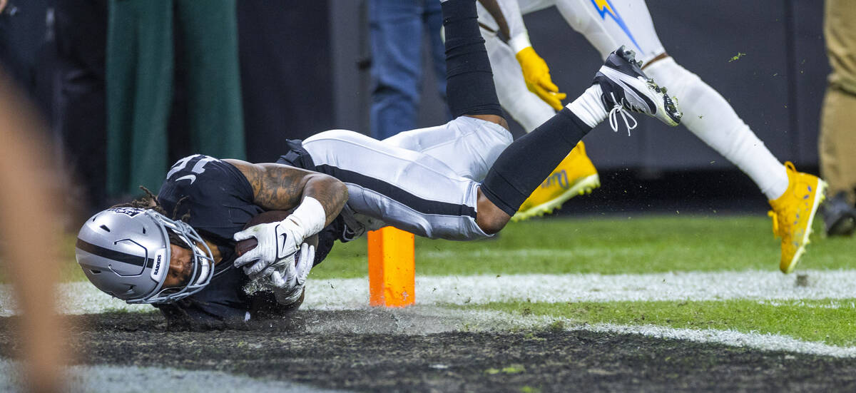 Raiders wide receiver Jakobi Meyers (16) dives into the end zone for a touchdown reception agai ...