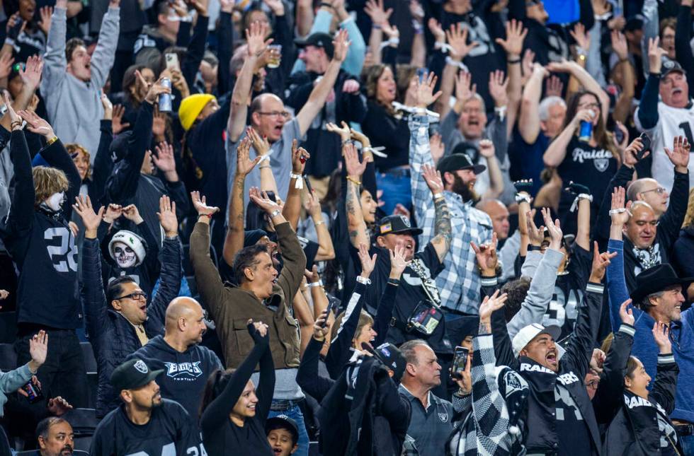 Raiders fans celebrate as they dominate the Los Angeles Chargers during the second half of thei ...