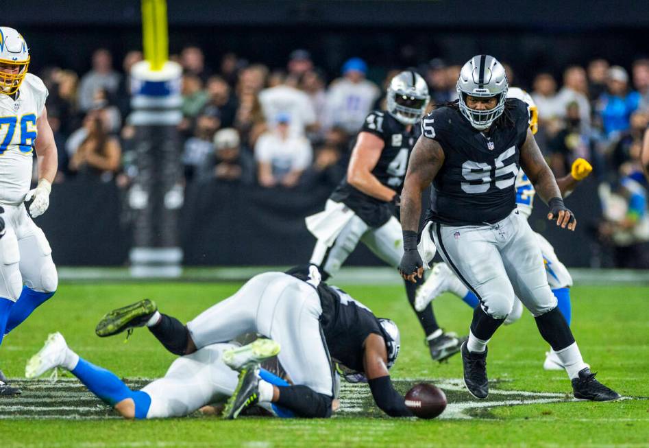 Raiders defensive tackle John Jenkins (95) eyes a Los Angeles Chargers fumble during the second ...