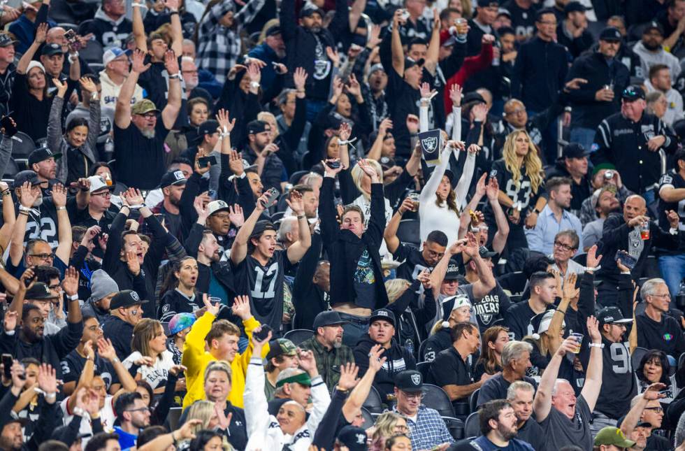 Raiders fans celebrate as they dominate the Los Angeles Chargers during the second half of thei ...