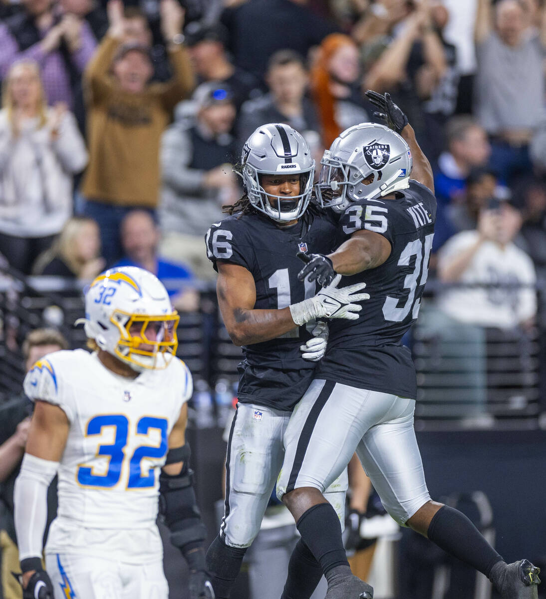 Raiders wide receiver Jakobi Meyers (16) celebrates a touchdown with running back Zamir White ( ...