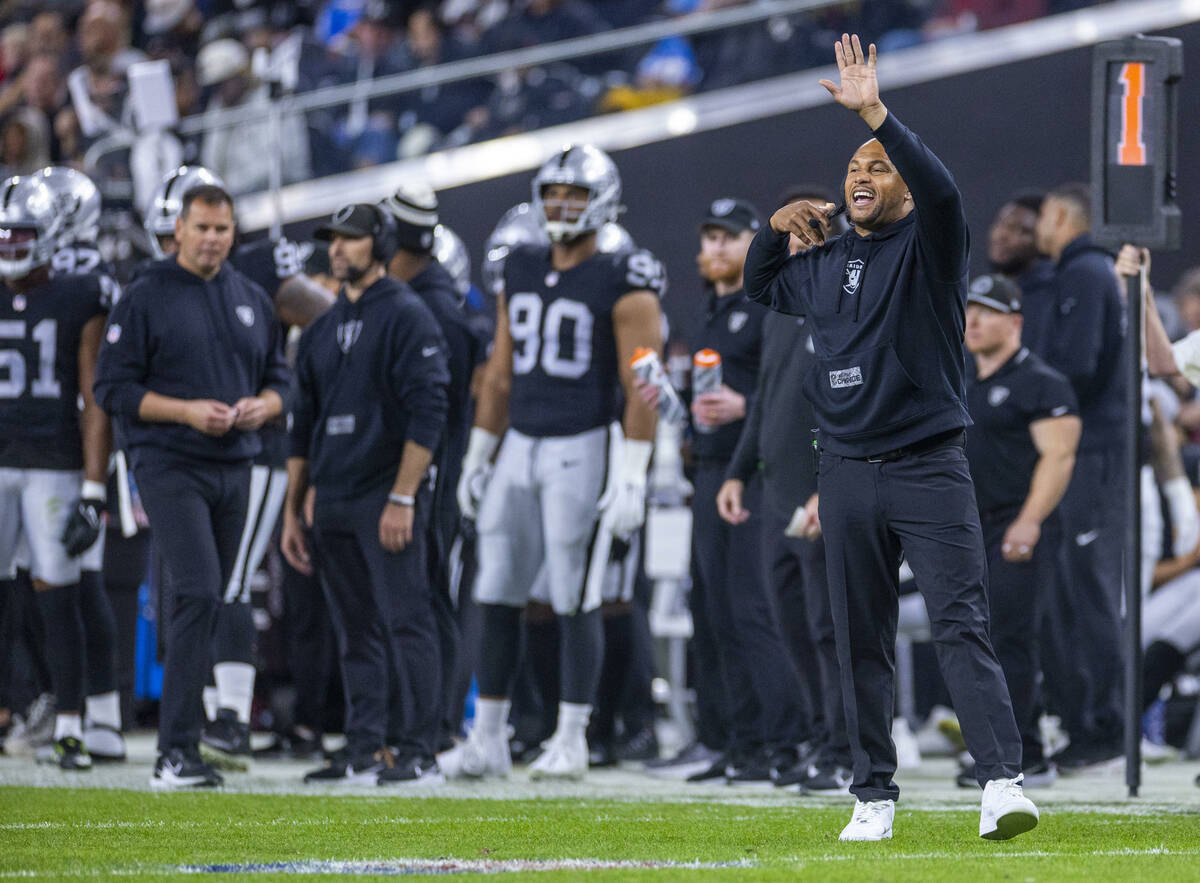 Raiders interim head coach Antonio Pierce argues a penalty for the Los Angeles Chargers during ...