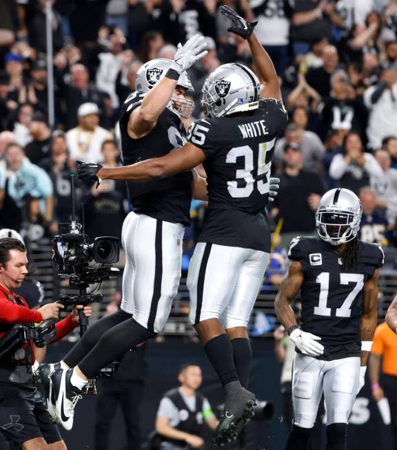 Raiders tight end Michael Mayer (87) celebrates his touchdown with teammate running back Zamir ...