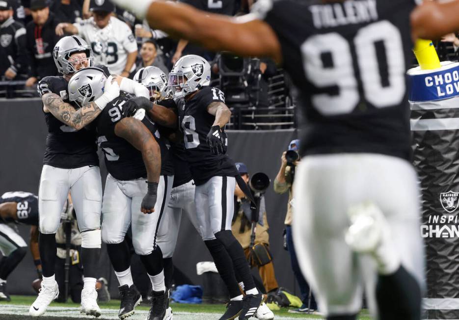 Raiders defensive tackle John Jenkins (95) celebrates his touchdown with his teammates after re ...