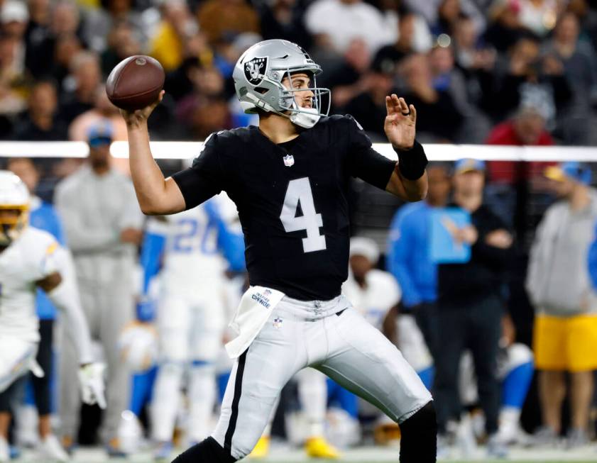 Raiders quarterback Aidan O'Connell (4) throws a pass against Los Angeles Chargers during the f ...