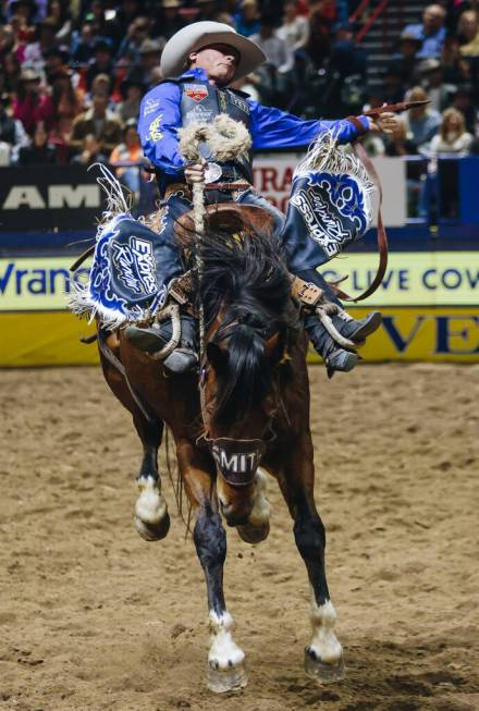 Ryder Wright stays on the horse during the National Finals Rodeo at the Thomas & Mack Cente ...