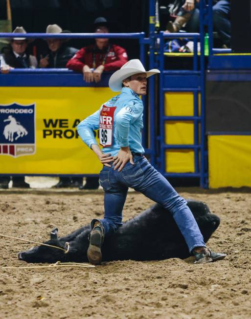 Tuf Cooper looks back as eh realizes he dropped his piggin string across the arena during the N ...