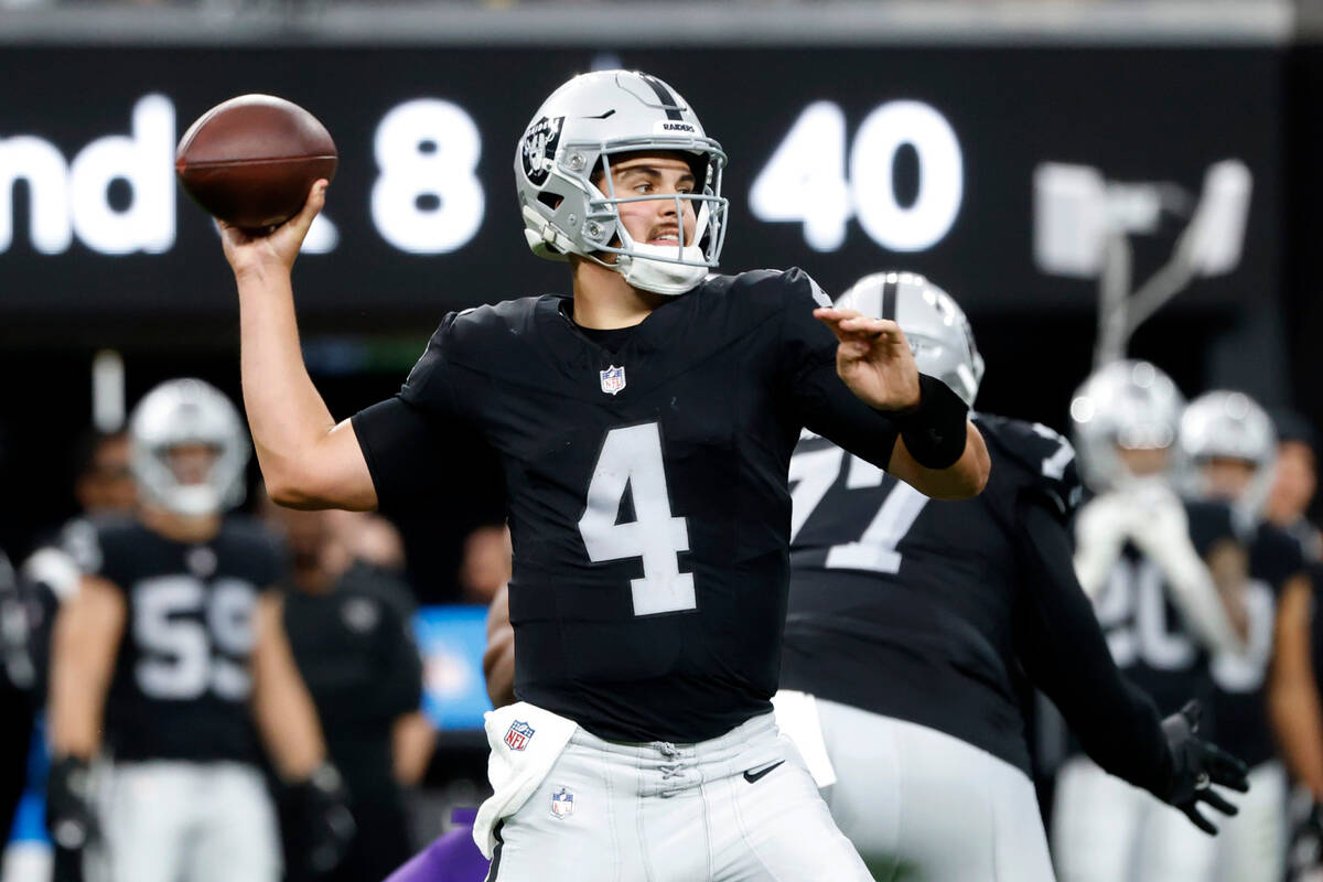 Raiders quarterback Aidan O'Connell (4) throws a pass during the first half of an NFL football ...