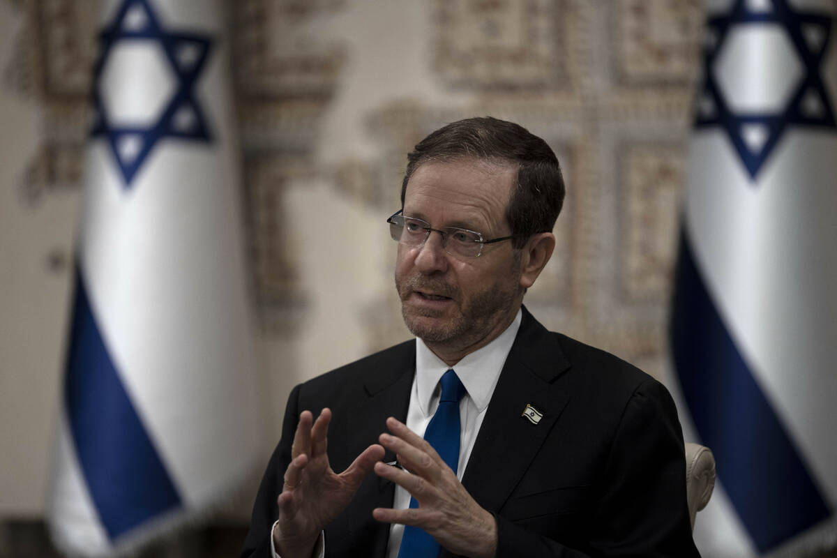 Israel's President Isaac Herzog speaks during an interview at his official residence in Jerusal ...