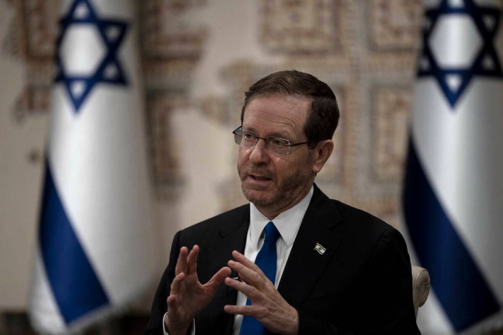 Israel's President Isaac Herzog speaks during an interview at his official residence in Jerusal ...