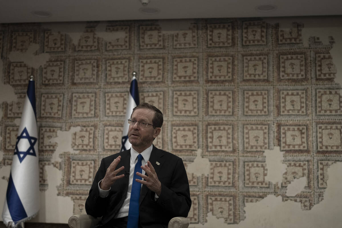 Israel's President Isaac Herzog speaks during an interview at his official residence in Jerusal ...