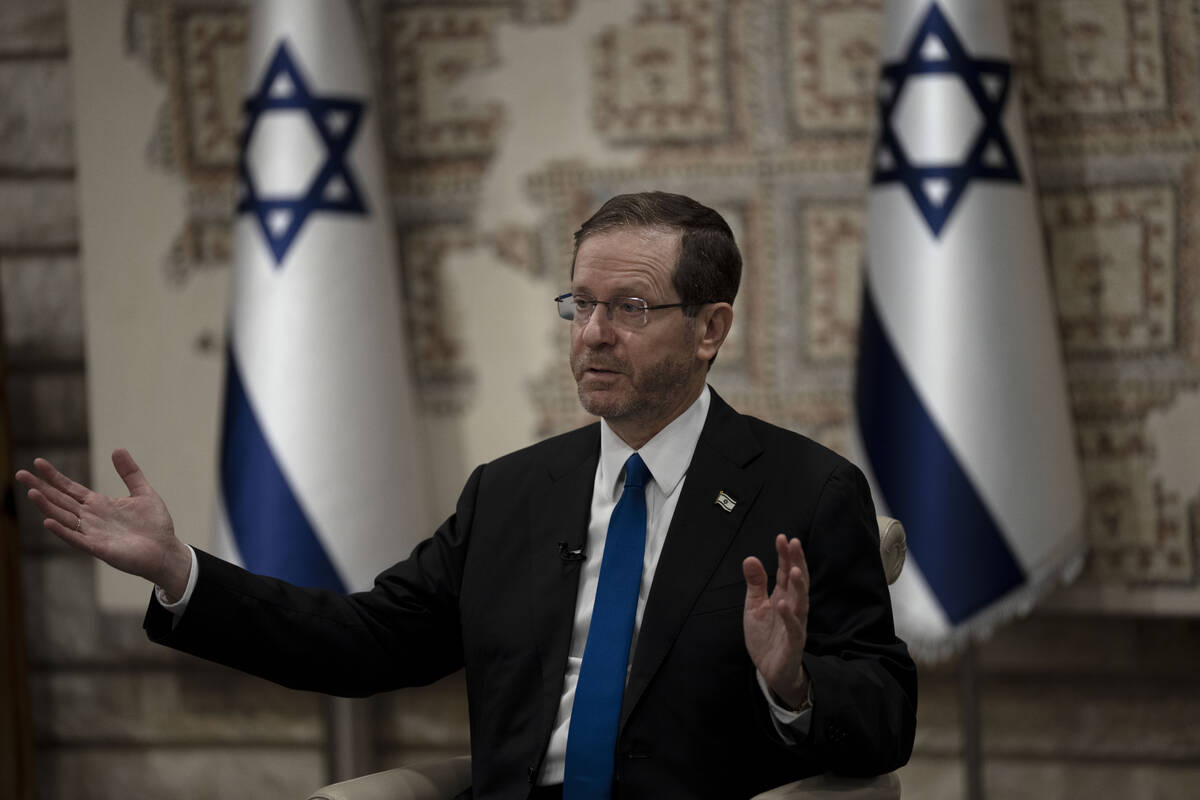 Israel's President Isaac Herzog speaks during an interview at his official residence in Jerusal ...