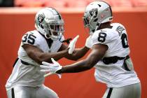 Raiders running back Zamir White (35) and running back Josh Jacobs (8) run drills together befo ...