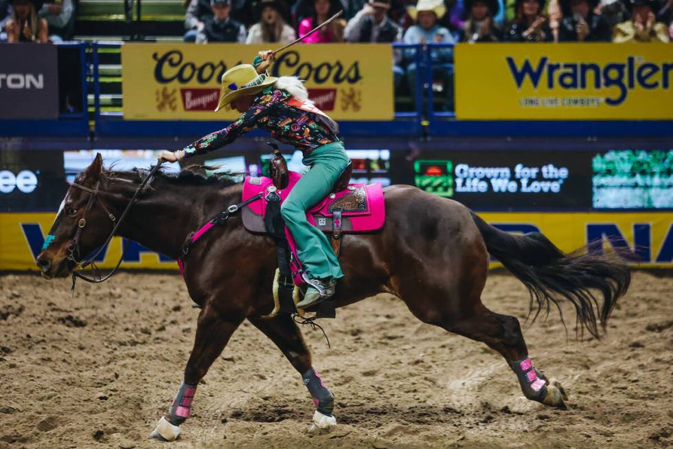 Summer Kosel races her horse during the barrel racing portion of the National Finals Rodeo at t ...