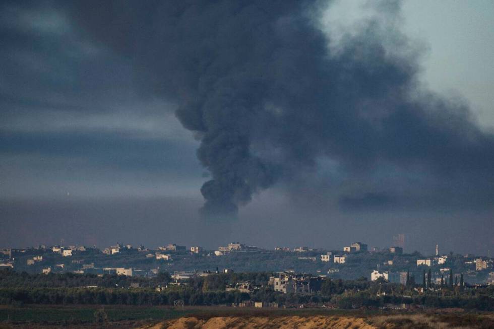 Smoke rises following an Israeli bombardment in the Gaza Strip, as seen from southern Israel, F ...