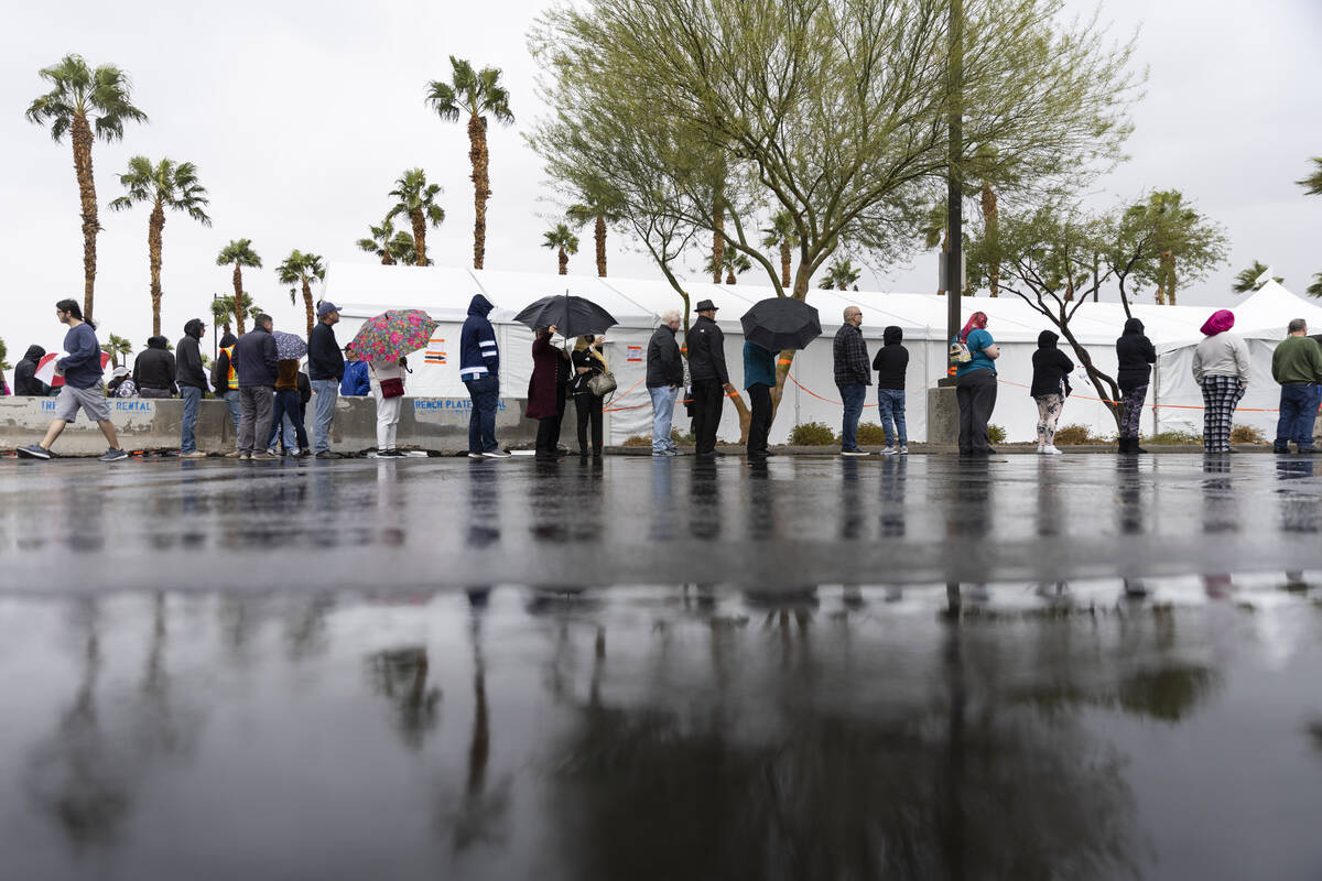 People wait in line to cast their vote at the Centennial Center polling place in Las Vegas, Tue ...