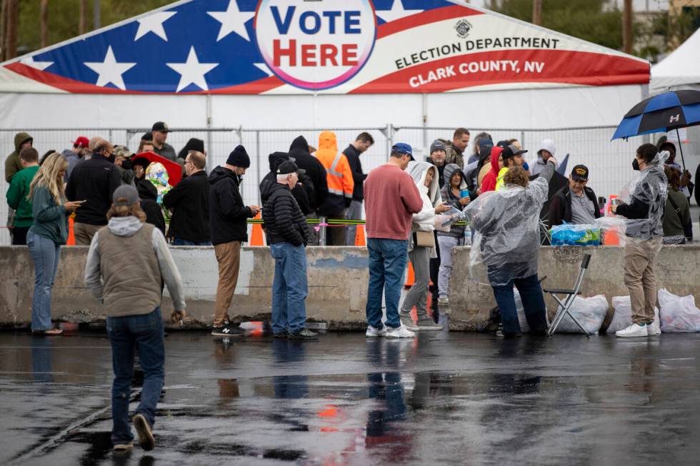 People wait in line to cast their vote at the Centennial Center polling place in Las Vegas, Tue ...