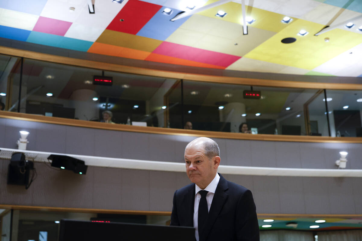 Germany's Chancellor Olaf Scholz arrives for a round table meeting at an EU summit in Brussels, ...