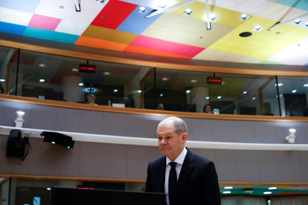 Germany's Chancellor Olaf Scholz arrives for a round table meeting at an EU summit in Brussels, ...