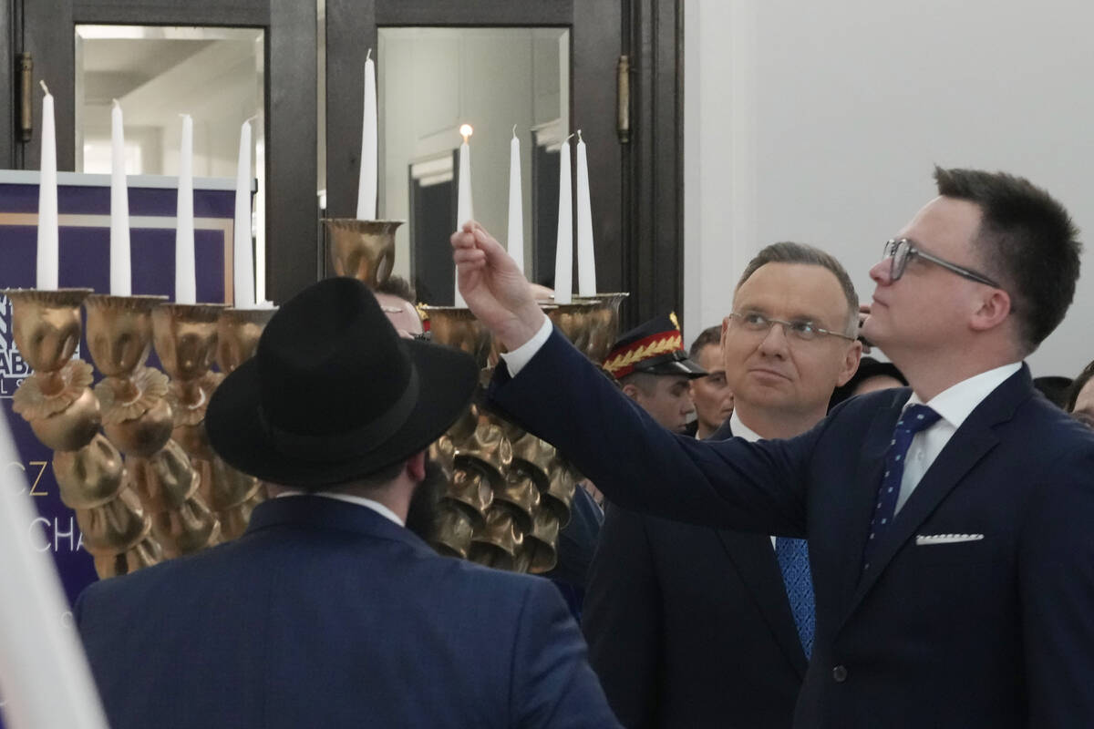 President Andrzej Duda, second right, Speaker of the Polish Parliament Szymon Holownia, right, ...