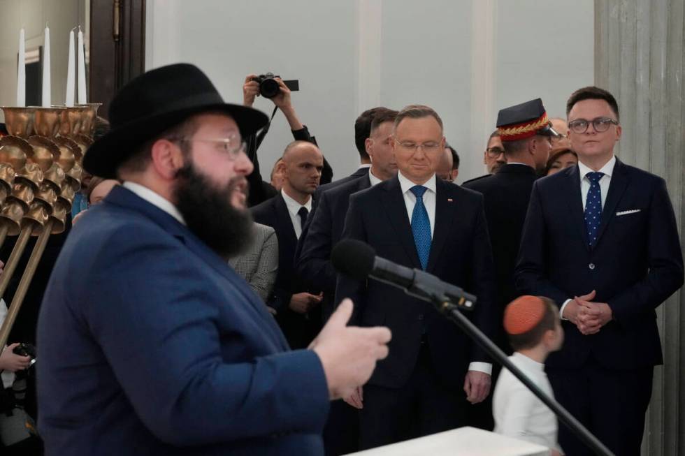 President Andrzej Duda, second right, Speaker of the Polish Parliament Szymon Holownia, right, ...