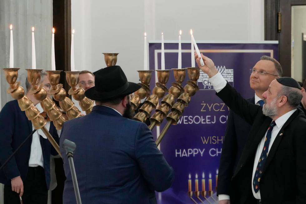 Members of parliament, President Andrzej Duda, second right, and the Polish Jewish community co ...