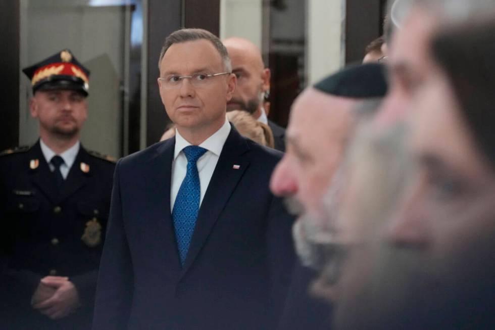 Members of parliament, President Andrzej Duda, second left, and the Polish Jewish community com ...