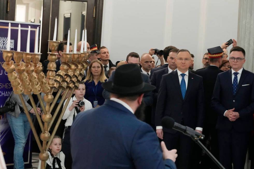 President Andrzej Duda, second right, Speaker of the Polish Parliament Szymon Holownia, right, ...