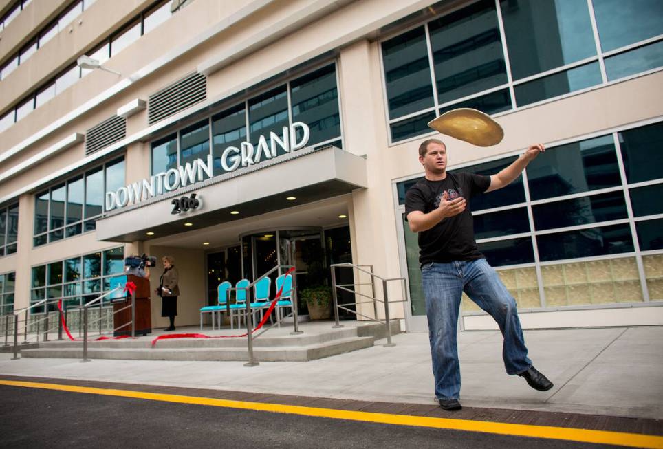 Siler Chapman (cq), a chef at Pizza Rock, tosses pizza dough after the ribbon cutting ceremony ...