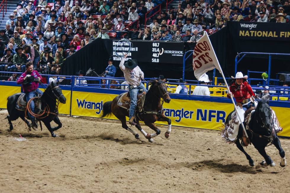 Tyler Wade and Wesley Thorpe run a victory lap on their horses after team toping during the Nat ...