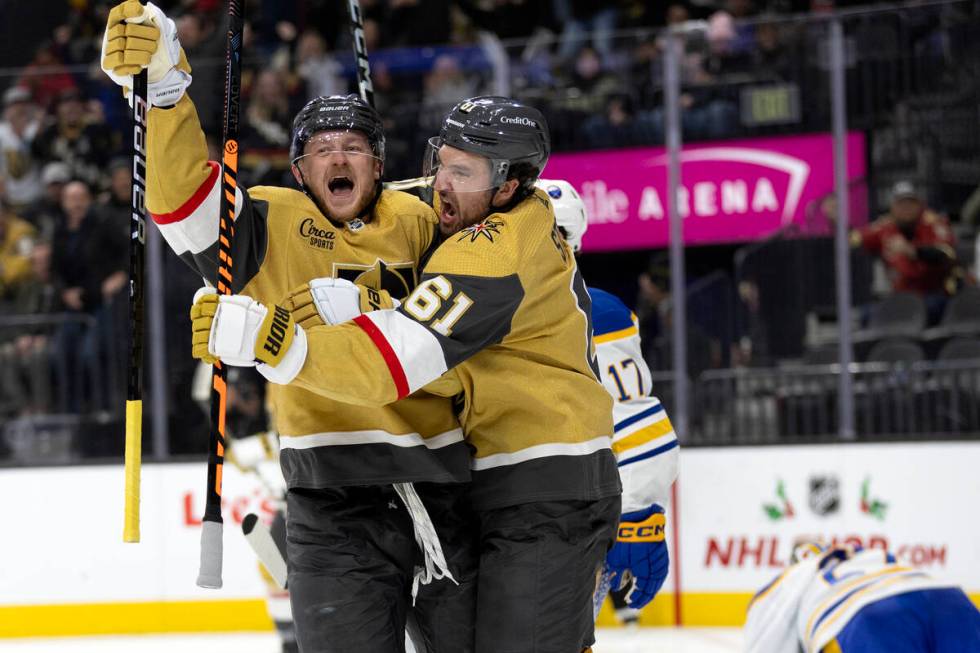 Golden Knights center Jack Eichel (9) and right wing Mark Stone (61) celebrate Eichel’s ...