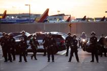 Police hold the line, preventing members of CeaseFireLA to march into the Los Angeles Internati ...