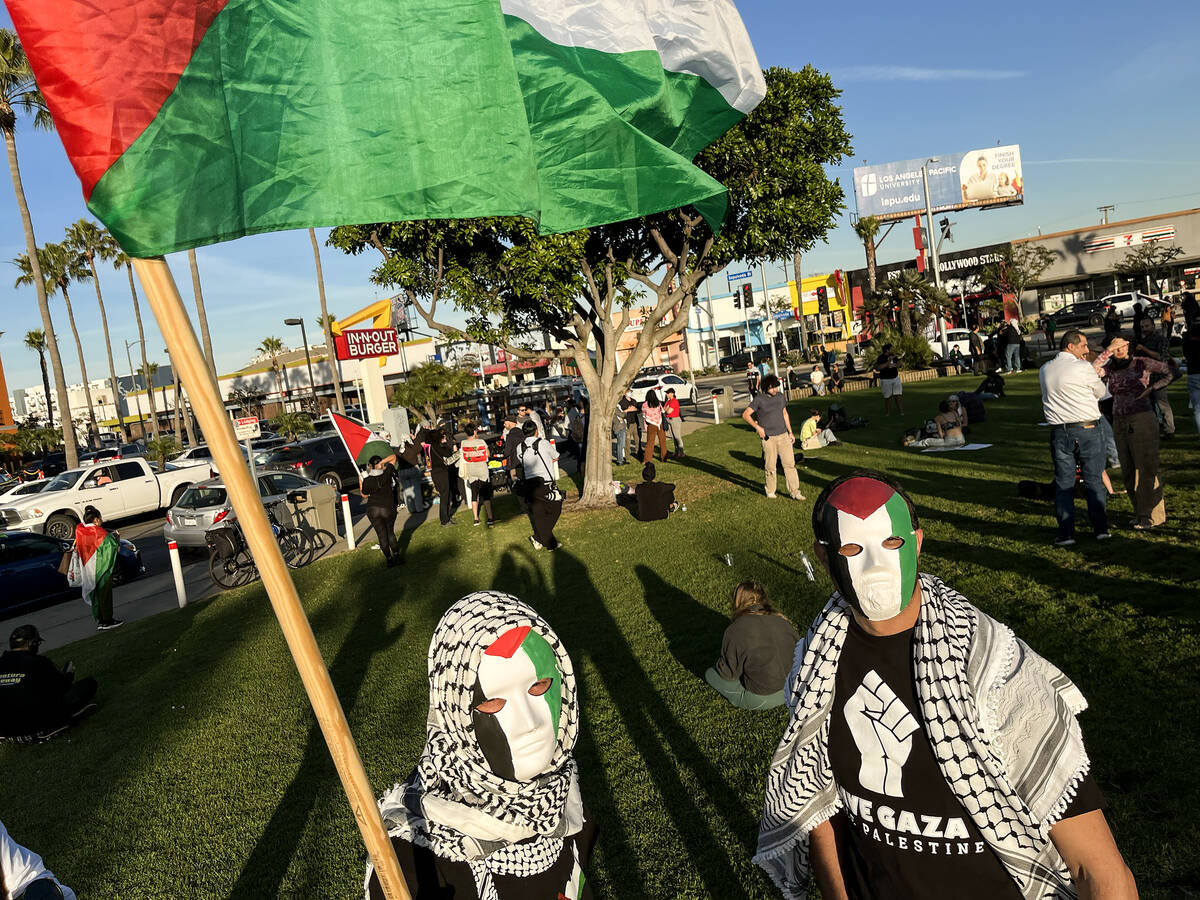 Members of CeaseFireLA rally at Airport Landing View Point, next to Los Angeles International A ...