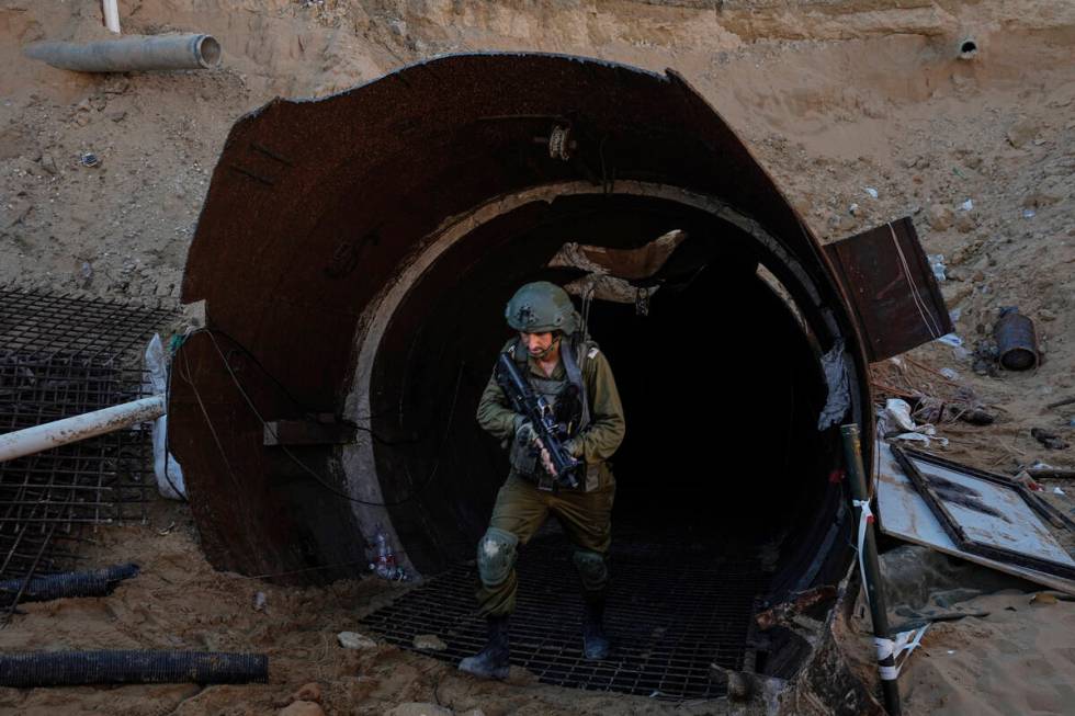 Israeli soldiers exit a tunnel that the military says Hamas militants used to attack the Erez c ...