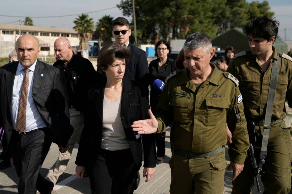 French Foreign Minister Catherine Colonna, center left, talks with Israeli Col. Olivier Rafowic ...