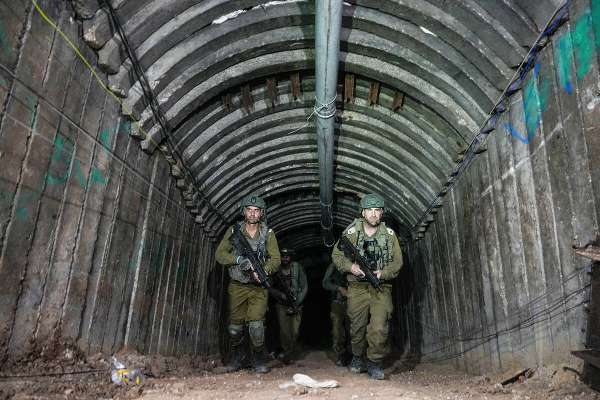 Israeli soldiers are seen in a tunnel that the military says Hamas militants used to attack the ...