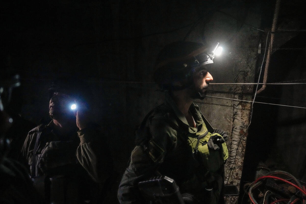 Israeli soldiers are seen in a tunnel that the military says Hamas militants used to attack the ...