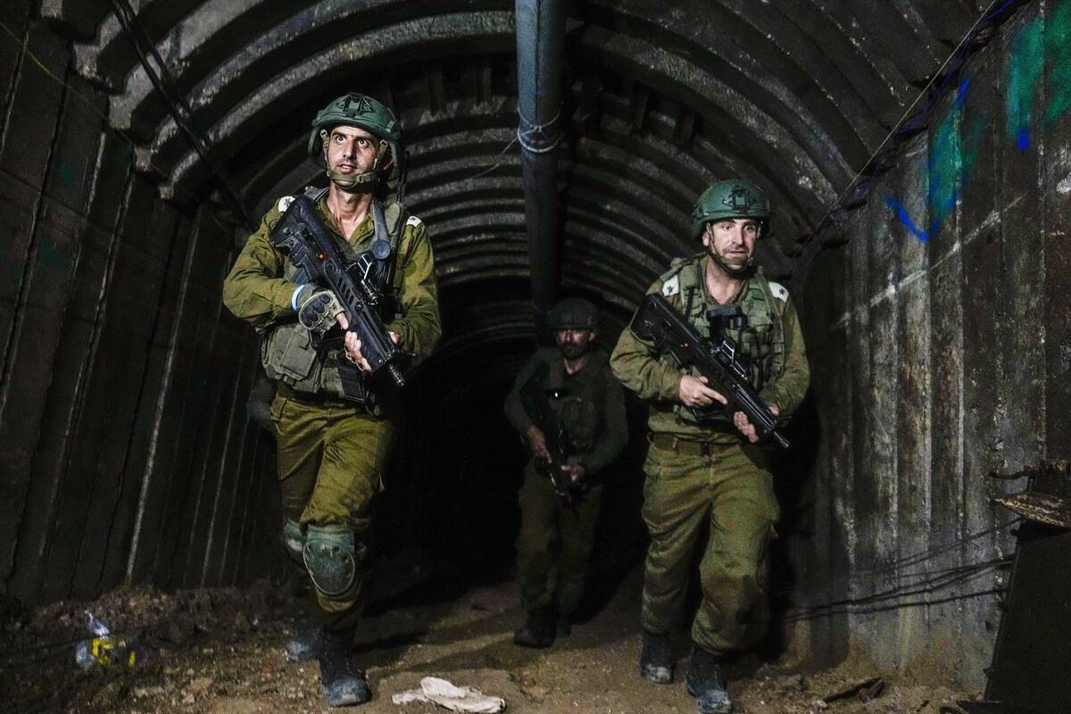 Israeli soldiers are seen in a tunnel that the military says Hamas militants used to attack the ...